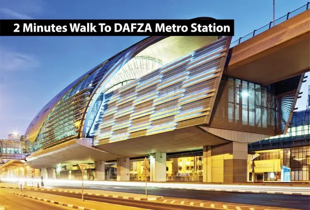 A curved, illuminated metro station building at dusk with a black text banner across the top reading 2 Minutes Walk To DAFZA Metro Station.