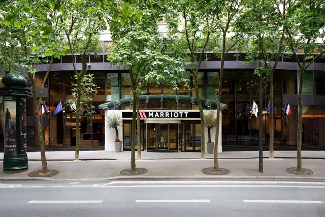 The Marriott hotel entrance faces a tree-lined Parisian street.